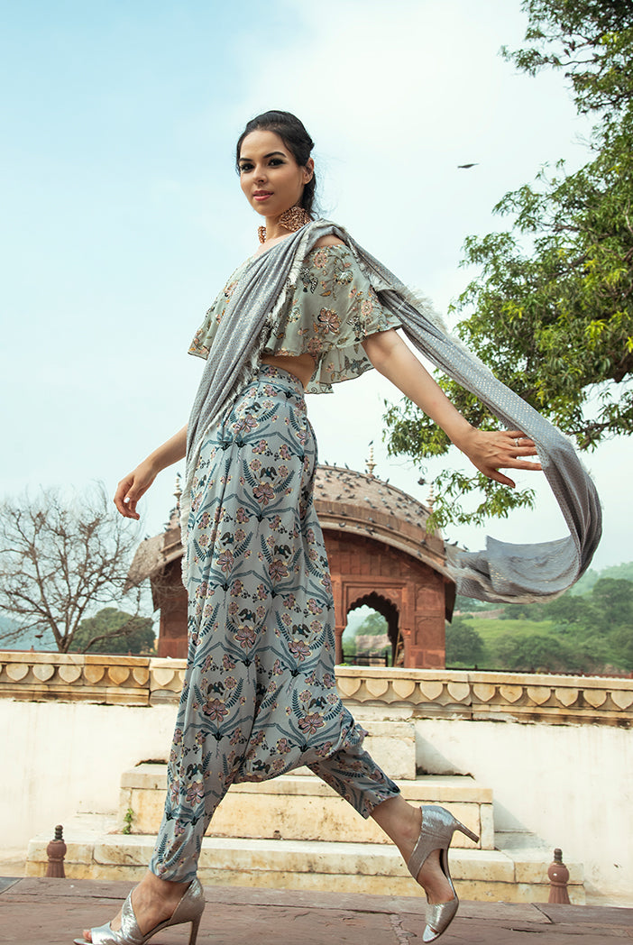 Darisa Mint Printed Crepe Off Shoulder Ruffle Choli with Powder Blue Printed Low Crotch pant and Mukaish Georgette attac