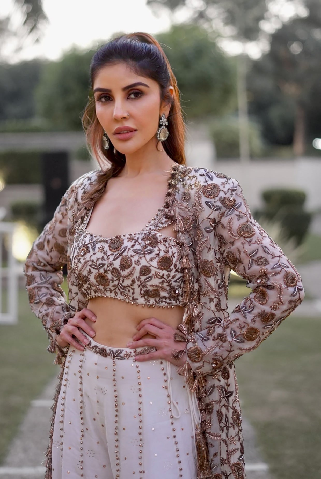 Off-White Georgette Embroidered Choli And Mukaish Silkmul Sharara With Organza Embroidered Jacket With Tassels.