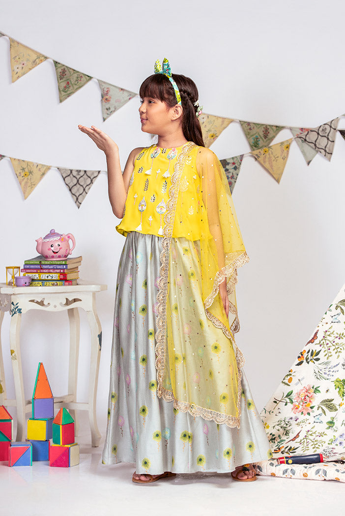 Yellow Crepe Top with Grey printed Silkmul Lehenga and Yellow Net Dupatta