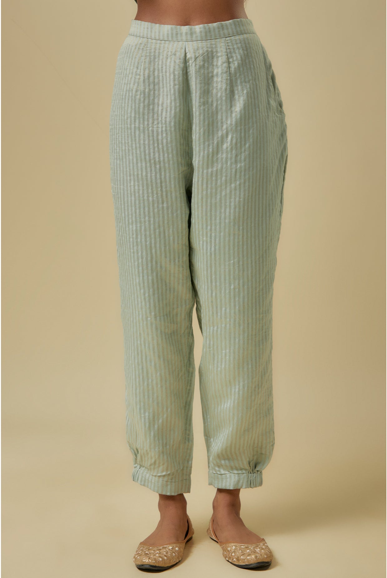 Pale Blue Gold Stripes Chanderi Embroidered Yoke Short Kurta And Jogger Pants With Mukaish Net Dupatta.