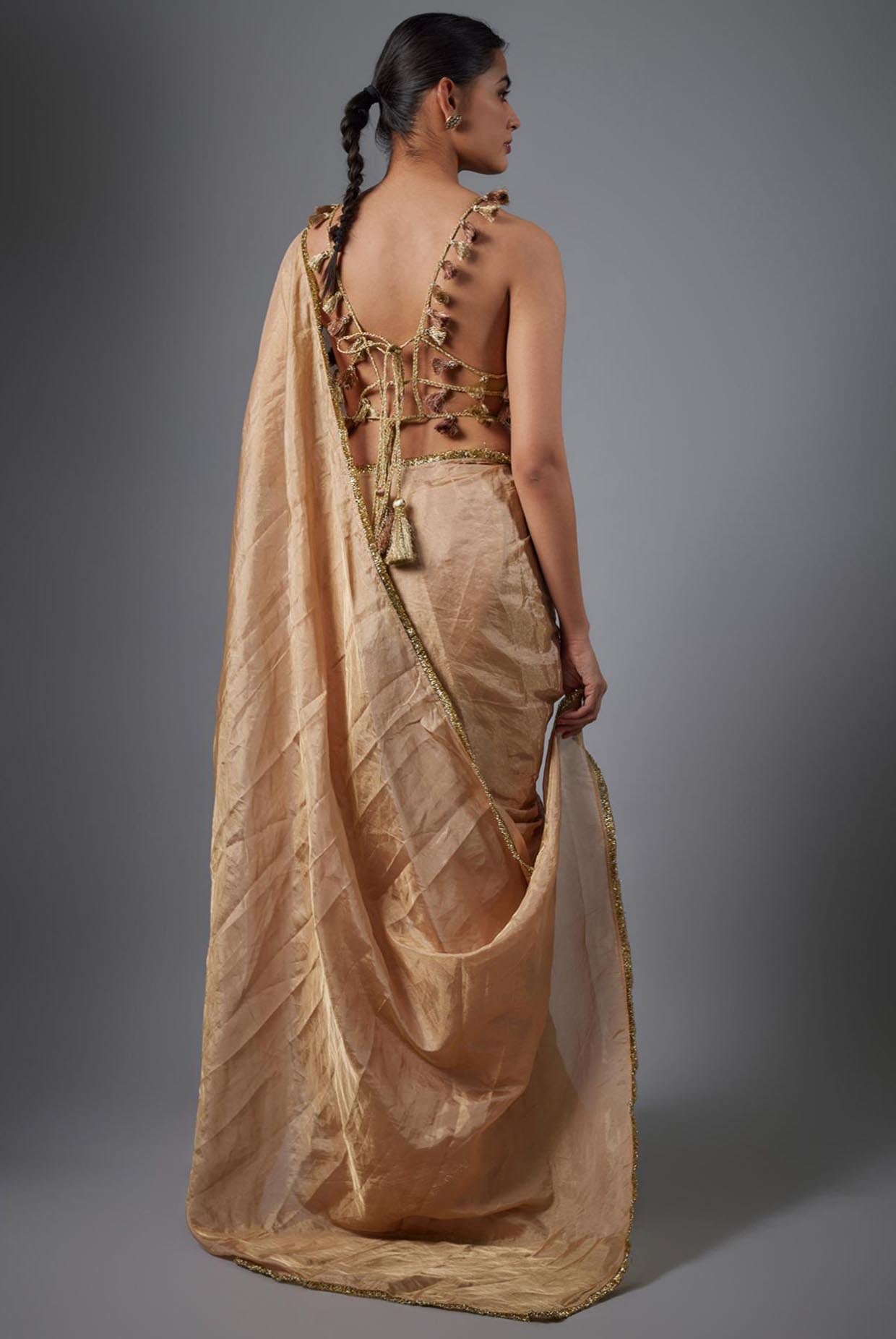 Dull Rose Color Embroidered Tissue Fabric Short Choli With Stitched Saree.