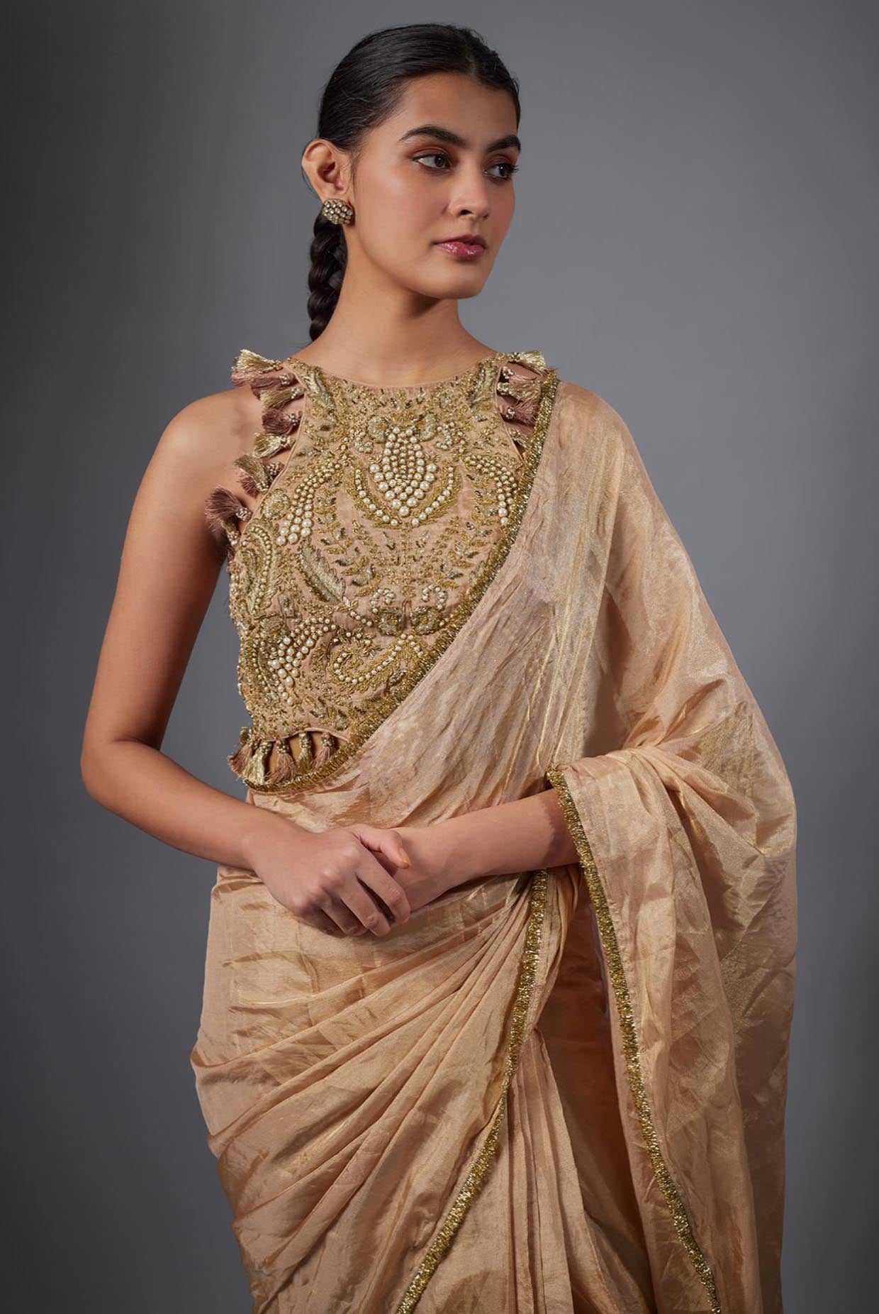 Dull Rose Color Embroidered Tissue Fabric Short Choli With Stitched Saree.