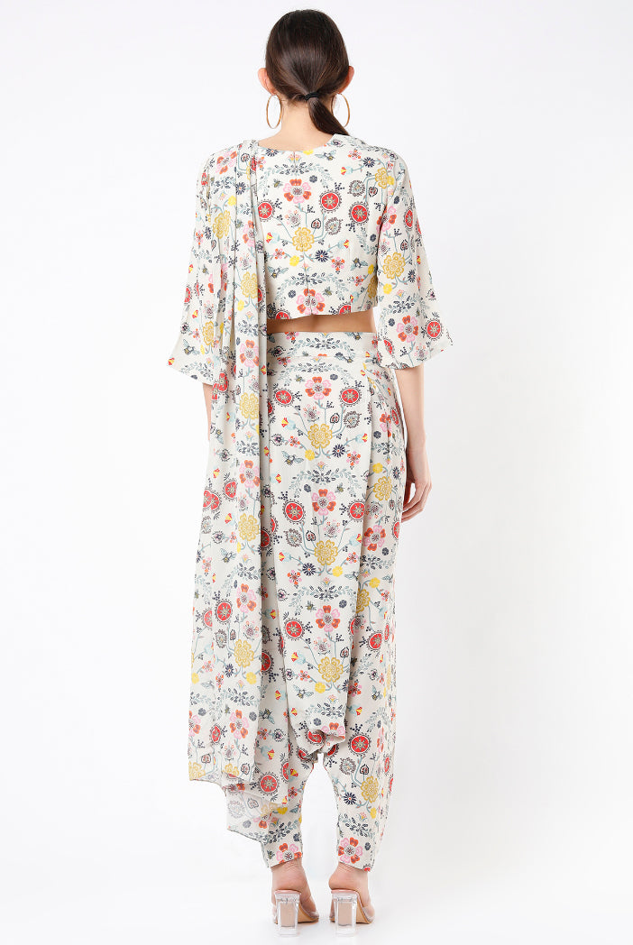 Cream Spring Print Georgette Crop Top With Low Crotch Pant And Attached Georgette Drape With Tassels
