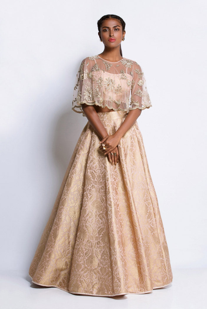 Blush Brocade Bustier and Lehenga with Net Cape