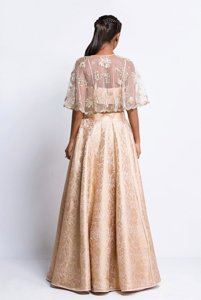 Blush Brocade Bustier and Lehenga with Net Cape