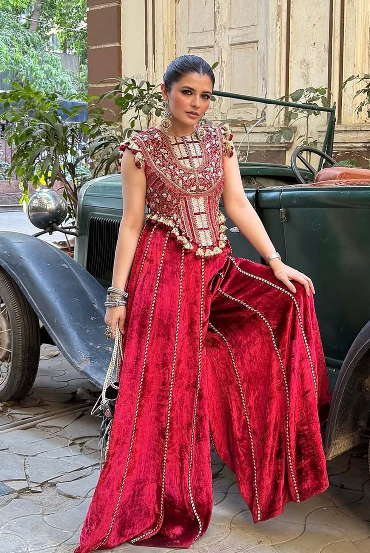 Benazir Dark Red Embroidered Velvet Choli With Sharara Pants.