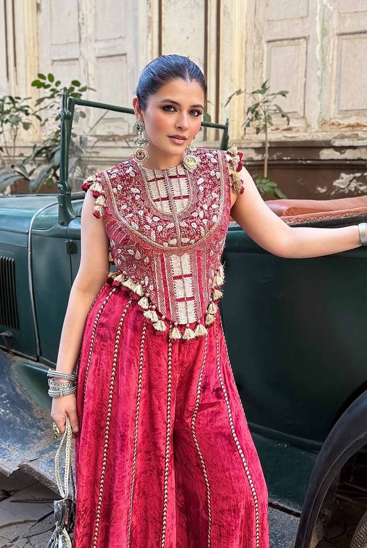 Benazir Dark Red Embroidered Velvet Choli With Sharara Pants.
