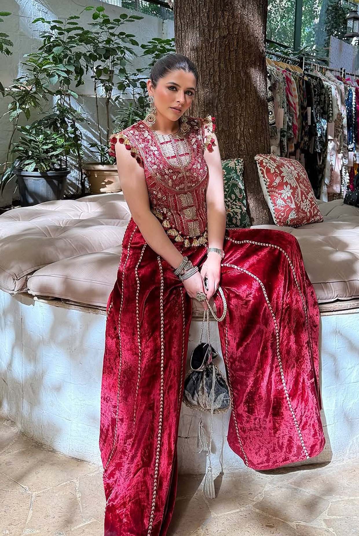 Benazir Dark Red Embroidered Velvet Choli With Sharara Pants.