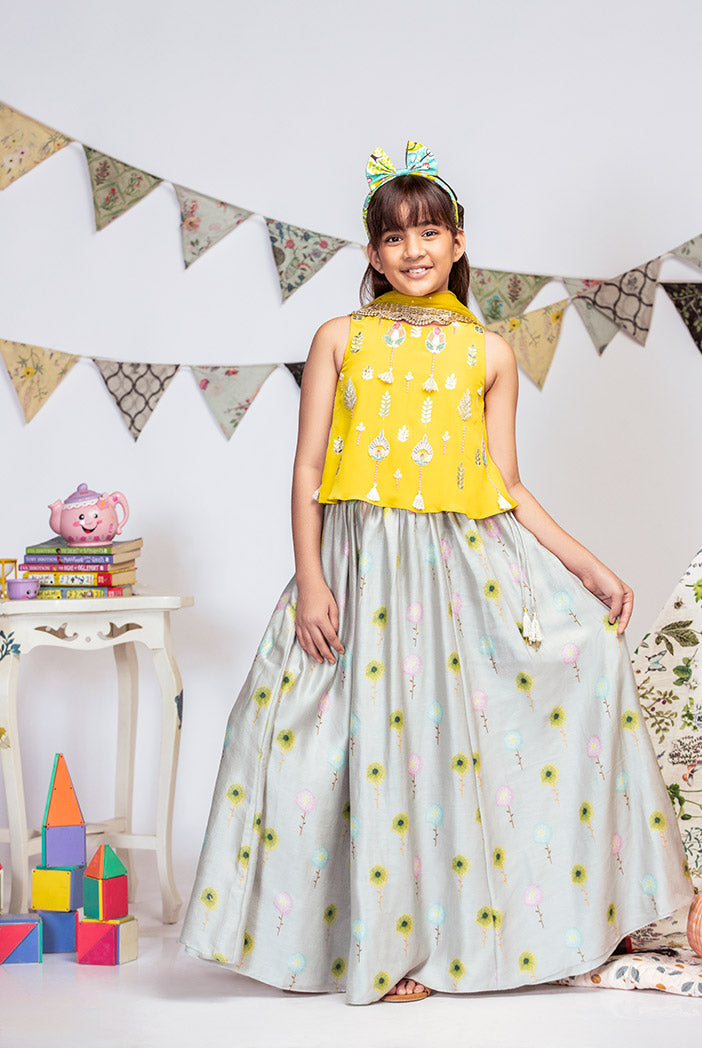 Yellow Crepe Top with Grey printed Silkmul Lehenga and Yellow Net Dupatta