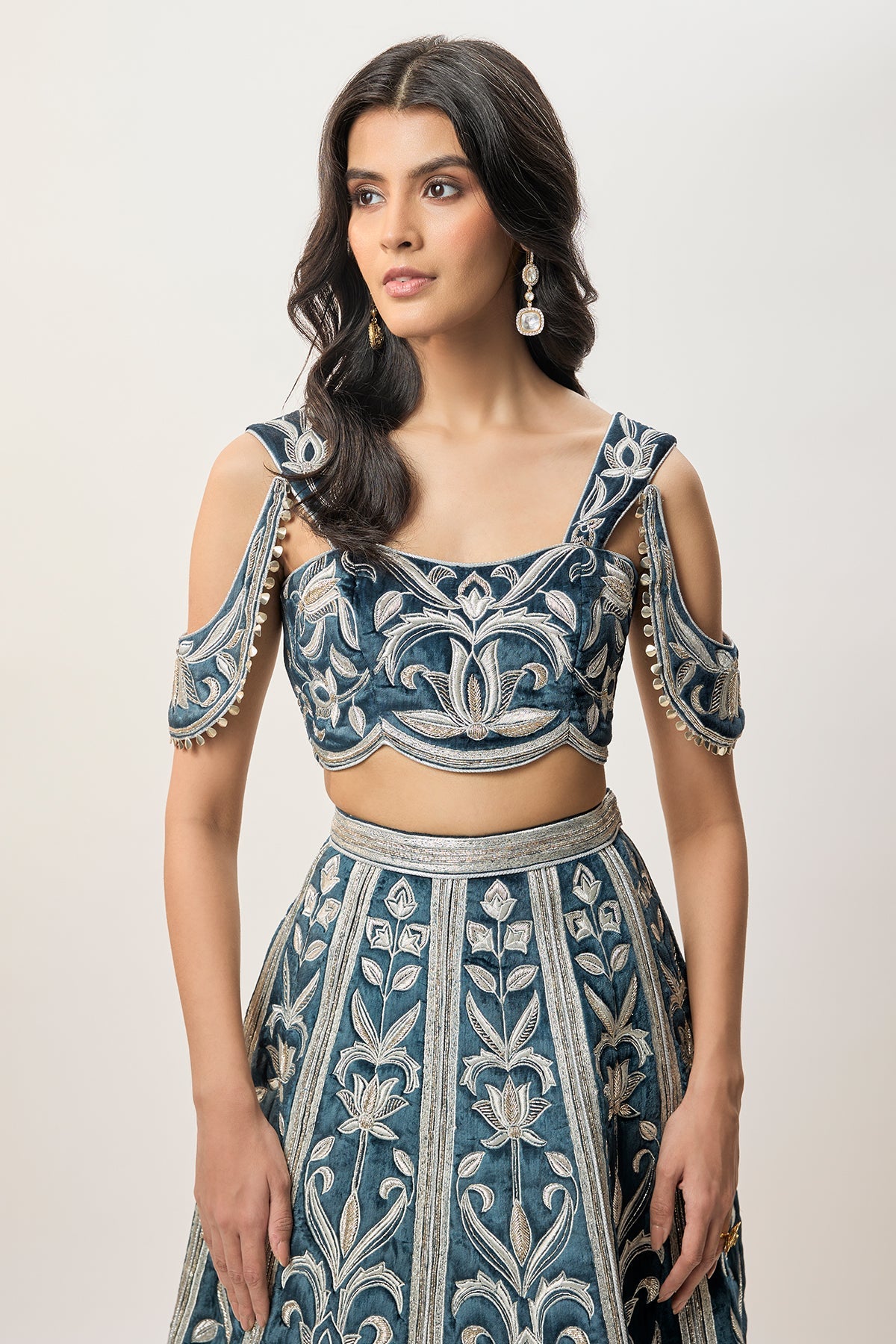 Sahar Navy Blue Velvet Quilted Embroidered Choli With Attached Embroidered Bajuband And Quilted Lehenga.