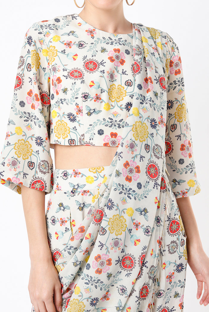 Cream Spring Print Georgette Crop Top With Low Crotch Pant And Attached Georgette Drape With Tassels
